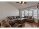 Cozy living room with a large bay window and hardwood floors at 1109 E San Pedro Ave, Gilbert, AZ 85234