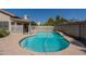 Sparkling backyard pool and patio area with white fence and nearby pergola at 1109 E San Pedro Ave, Gilbert, AZ 85234
