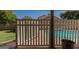 Inviting view of the backyard pool through a white picket fence at 1109 E San Pedro Ave, Gilbert, AZ 85234