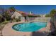 Inviting backyard pool with white fence, perfect for outdoor relaxation and entertaining at 1109 E San Pedro Ave, Gilbert, AZ 85234