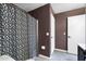 Bathroom with tile flooring and a shower with a stylish patterned curtain at 1120 N Val Vista Dr # 110, Gilbert, AZ 85234