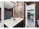 Bathroom featuring a vanity with a sink, a large mirror, and open doorway at 1120 N Val Vista Dr # 110, Gilbert, AZ 85234