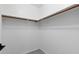 Walk-in closet with white walls, wood shelving, and carpet floors at 1120 N Val Vista Dr # 110, Gilbert, AZ 85234