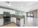 Bright kitchen with stainless steel appliances, granite countertops, and an adjacent dining area at 1120 N Val Vista Dr # 110, Gilbert, AZ 85234