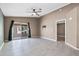 Open living space with tile flooring, ceiling fan, and access to the outdoor patio at 1120 N Val Vista Dr # 110, Gilbert, AZ 85234