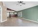 Open floor plan with tile floors, and view of the kitchen and stainless steel appliances at 1120 N Val Vista Dr # 110, Gilbert, AZ 85234