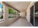 Covered patio with an open-air view of the backyard landscaping and a smooth concrete floor at 1120 N Val Vista Dr # 110, Gilbert, AZ 85234
