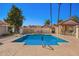 Community pool with tables and lounge chairs for relaxing under a clear blue sky at 1120 N Val Vista Dr # 110, Gilbert, AZ 85234
