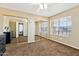 Spacious bedroom with plush carpeting, large windows, and mirrored closet doors for ample storage at 1126 W Elliot Rd # 1066, Chandler, AZ 85224