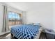 Bright bedroom featuring a large window providing a view of the outdoors at 1126 W Elliot Rd # 1066, Chandler, AZ 85224