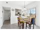 Cozy dining area with sliding glass doors and kitchen access, bathed in natural light at 1126 W Elliot Rd # 1066, Chandler, AZ 85224