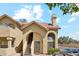Charming two-story condo features desert landscaping, a tile roof, and arched entry stairs at 1126 W Elliot Rd # 1066, Chandler, AZ 85224
