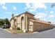 Exterior building corner with parking, small lawn, and attached garages at 1126 W Elliot Rd # 1066, Chandler, AZ 85224