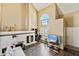 Bright, airy living room boasts vaulted ceilings, a stone fireplace, and large window at 1126 W Elliot Rd # 1066, Chandler, AZ 85224