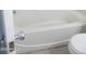 Compact bathroom showcasing a white bathtub with a modern door handle at 1130 E Butler Dr # B4, Phoenix, AZ 85020