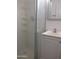 Tiled bathroom with frameless glass shower enclosure and vanity at 1130 E Butler Dr # B4, Phoenix, AZ 85020