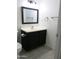 Functional bathroom with a modern vanity, square mirror, and neutral color scheme at 1130 E Butler Dr # B4, Phoenix, AZ 85020