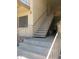 Exterior view of stairwell with unit B entrance, neutral color scheme, and metal railings at 1130 E Butler Dr # B4, Phoenix, AZ 85020