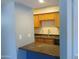 Well lit kitchen offers granite countertops, light wood cabinets and stainless steel sink at 1130 E Butler Dr # B4, Phoenix, AZ 85020