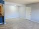 Open-concept living room with tile floors, view into the kitchen, and freshly painted walls at 1130 E Butler Dr # B4, Phoenix, AZ 85020