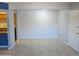 Inviting living area with cool gray walls, tile flooring and open kitchen access at 1130 E Butler Dr # B4, Phoenix, AZ 85020
