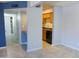Open floor plan living room with updated tile flooring, fresh paint and a kitchen view at 1130 E Butler Dr # B4, Phoenix, AZ 85020