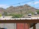 Scenic mountain view behind the rooftops showcasing desert living in a vibrant community at 1130 E Butler Dr # B4, Phoenix, AZ 85020