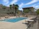 Community pool with desert views features lounge seating, a shaded area and lovely landscaping, a great spot to relax! at 1130 E Butler Dr # B4, Phoenix, AZ 85020