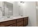 Bathroom boasts dual sinks, dark wood cabinets, and modern fixtures for convenience at 1131 E Bishop Dr, Tempe, AZ 85282