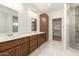 Elegant bathroom featuring a double vanity and a glass-enclosed shower at 1131 E Bishop Dr, Tempe, AZ 85282