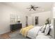Spacious bedroom features a ceiling fan, wood floors, and ensuite bathroom access at 1131 E Bishop Dr, Tempe, AZ 85282