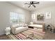 Playful bedroom featuring a daybed, sofa, and colorful rug creating an inviting and fun space at 1131 E Bishop Dr, Tempe, AZ 85282