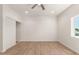 Bright, spacious bedroom with wood floors and recessed lighting, ready for your personal touch at 1131 E Bishop Dr, Tempe, AZ 85282