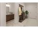 Inviting entryway with coat rack and access to a powder bathroom at 1131 E Bishop Dr, Tempe, AZ 85282