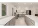 Spacious kitchen with stainless steel appliances, quartz countertops, and ample cabinet space at 1131 E Bishop Dr, Tempe, AZ 85282