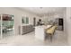 Modern kitchen with stainless steel appliances, an island with seating, and lots of cabinets at 1131 E Bishop Dr, Tempe, AZ 85282