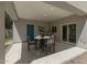 Covered patio features dining area, light gray walls, tile flooring, and outdoor access at 1131 E Bishop Dr, Tempe, AZ 85282