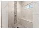 Beautiful shower featuring decorative tile and a built-in bench at 1131 E Bishop Dr, Tempe, AZ 85282