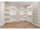 Expansive walk-in closet with built-in shelving and wooden clothes rods at 1131 E Bishop Dr, Tempe, AZ 85282