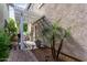 Charming backyard patio with a decorative pergola, potted plants, and manicured landscaping at 1324 S Banning St, Gilbert, AZ 85296