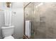 Bathroom featuring tiled shower, towel rack and neutral walls at 1324 S Banning St, Gilbert, AZ 85296