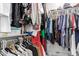 Walk-in closet with a variety of clothing and ample storage space at 1324 S Banning St, Gilbert, AZ 85296