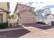 Charming home exterior with a spacious driveway, two-car garage, and neatly landscaped front yard at 1324 S Banning St, Gilbert, AZ 85296
