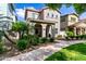 Charming two-story home features a covered porch, landscaped front yard, and well-maintained lawn, creating inviting curb appeal at 1324 S Banning St, Gilbert, AZ 85296