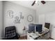 Inviting home office space featuring a spacious desk, stylish decor, and comfortable seating at 1324 S Banning St, Gilbert, AZ 85296