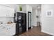 Modern kitchen featuring black appliances, shaker cabinets, pantry and hardwood floors at 1324 S Banning St, Gilbert, AZ 85296