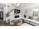 Bright living room with high ceilings, a modern fireplace, and stylish furnishings that create a comfortable and inviting space at 1324 S Banning St, Gilbert, AZ 85296