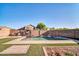 Private backyard oasis with refreshing pool and landscaped area at 13625 W Peck Ct, Litchfield Park, AZ 85340