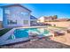 Backyard pool offers a refreshing escape with unique water features at 13625 W Peck Ct, Litchfield Park, AZ 85340
