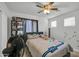 Lively bedroom with ceiling fan, and a neutral, whimsical decor at 13625 W Peck Ct, Litchfield Park, AZ 85340